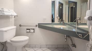 Room, 1 King Bed | Bathroom | Combined shower/bathtub, rainfall showerhead, designer toiletries