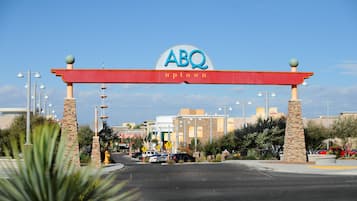 A large sign with "ABQ Uptown" indicating a commercial area.