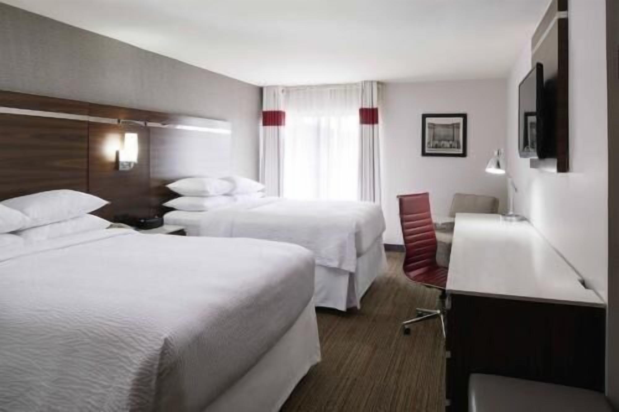 Premium bedding, desk, laptop workspace, iron/ironing board