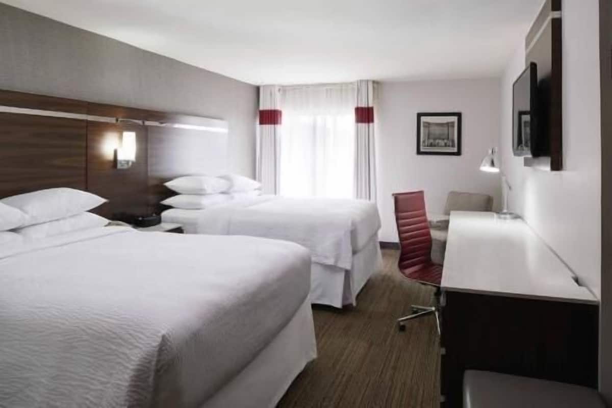 Premium bedding, desk, laptop workspace, iron/ironing board