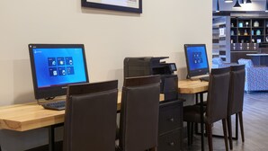 A workspace with two Lenovo computers, a printer, and a coffee machine. - Four Points by Sheraton Detroit Novi (Novi)