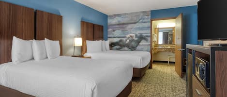 A hotel room with two beds, a television, a mirror, and a painting on the wall.