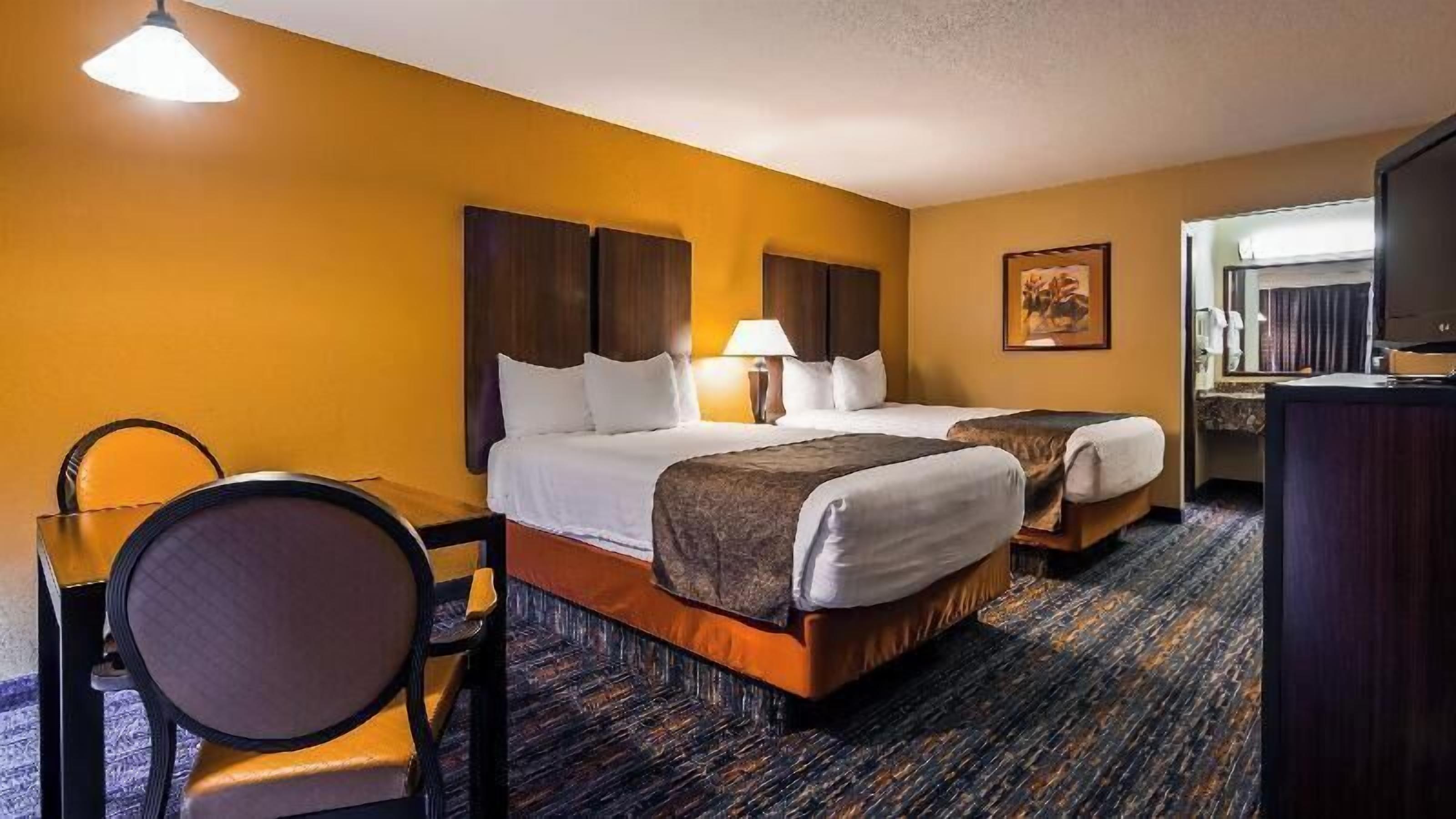 Premium bedding, down comforters, pillowtop beds, in-room safe