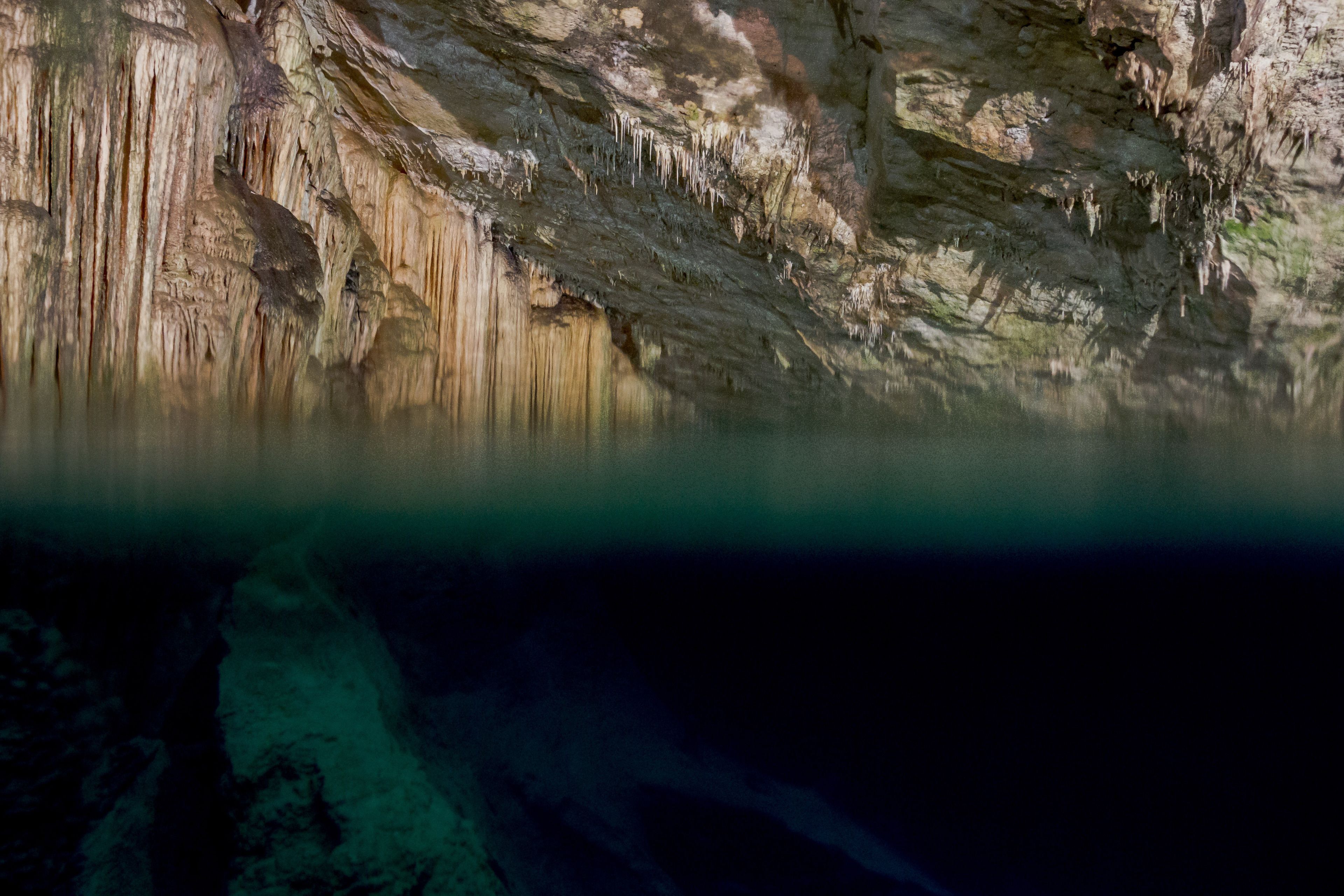 A cave with stalactites and stalagmites.
