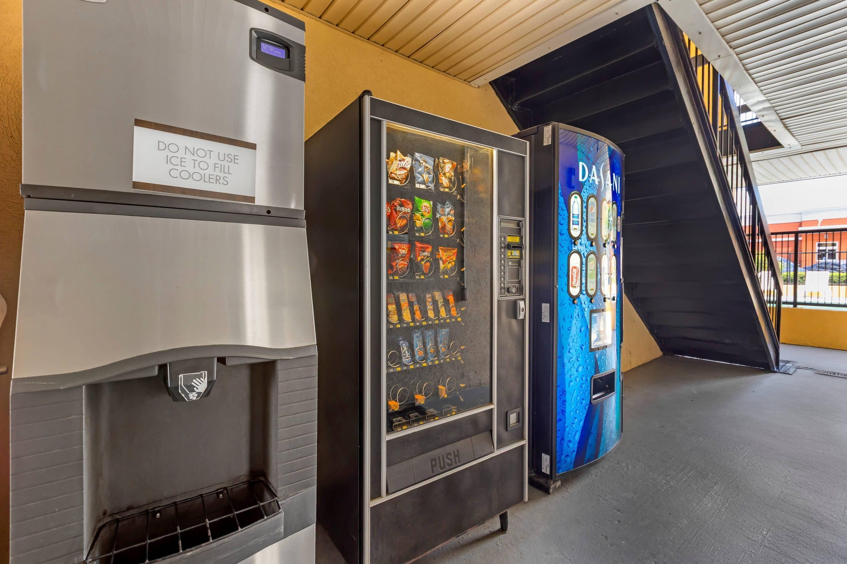 A vending machine with a variety of snacks and a sign advising against using ice to fill coolers.
