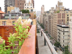 A high-rise building with multiple floors, large windows, and a mix of architectural styles. - Hotel Wales (New York)