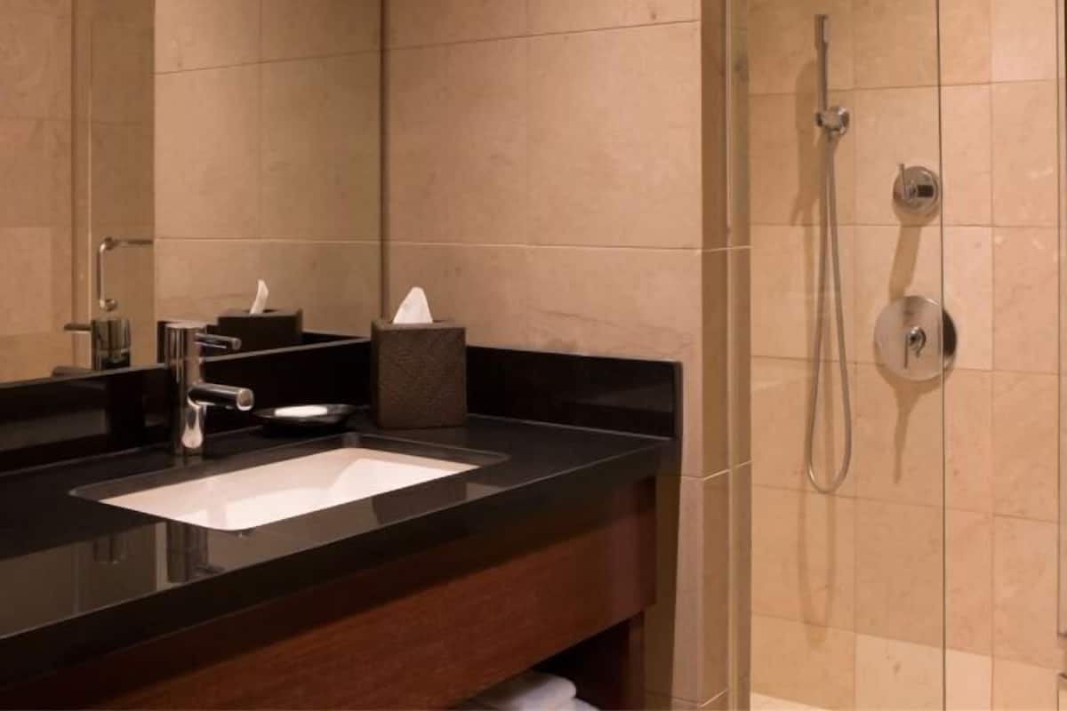 Designer toiletries, hair dryer, bathrobes, towels