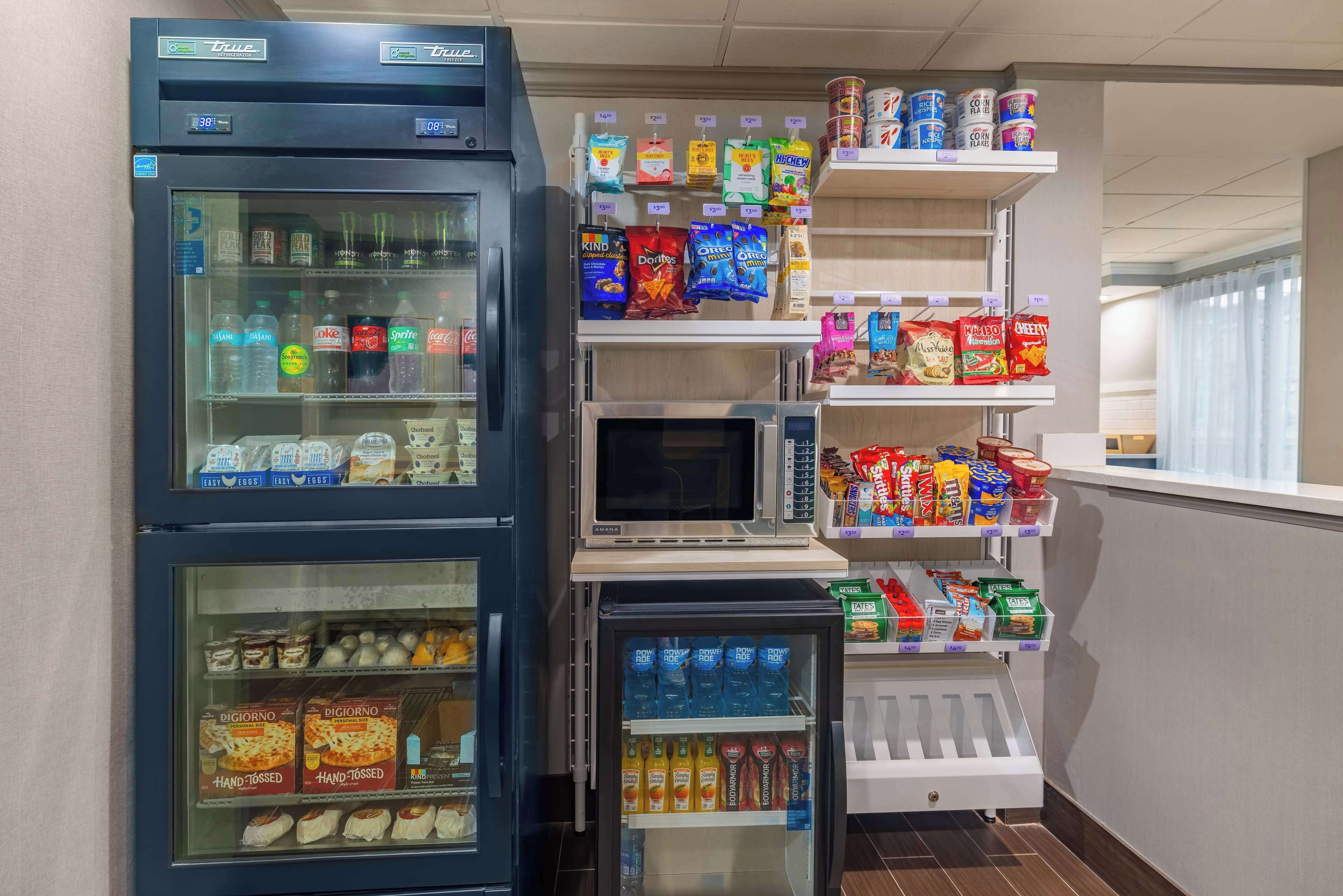 A vending machine area with various snacks and drinks.