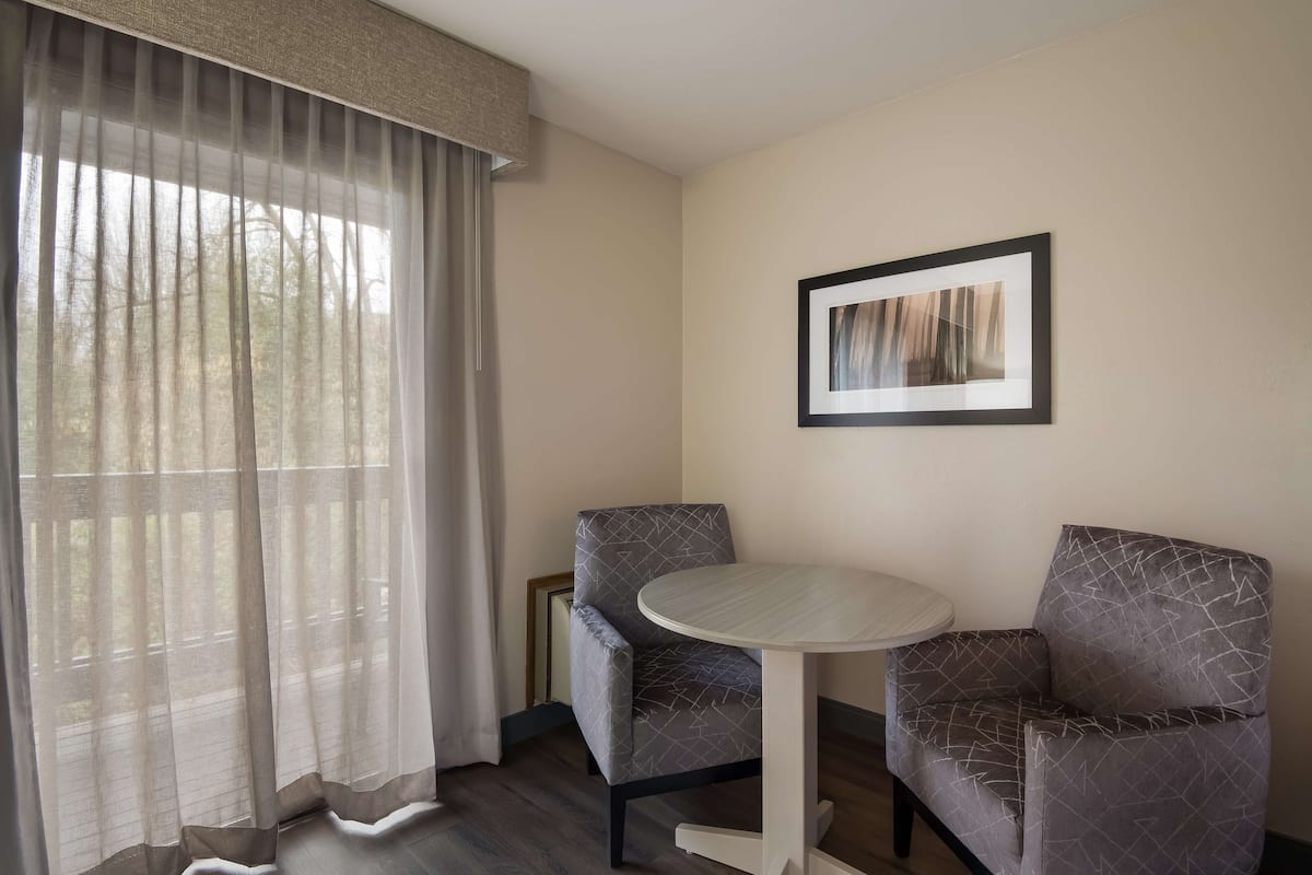 Desk, laptop workspace, blackout curtains, iron/ironing board