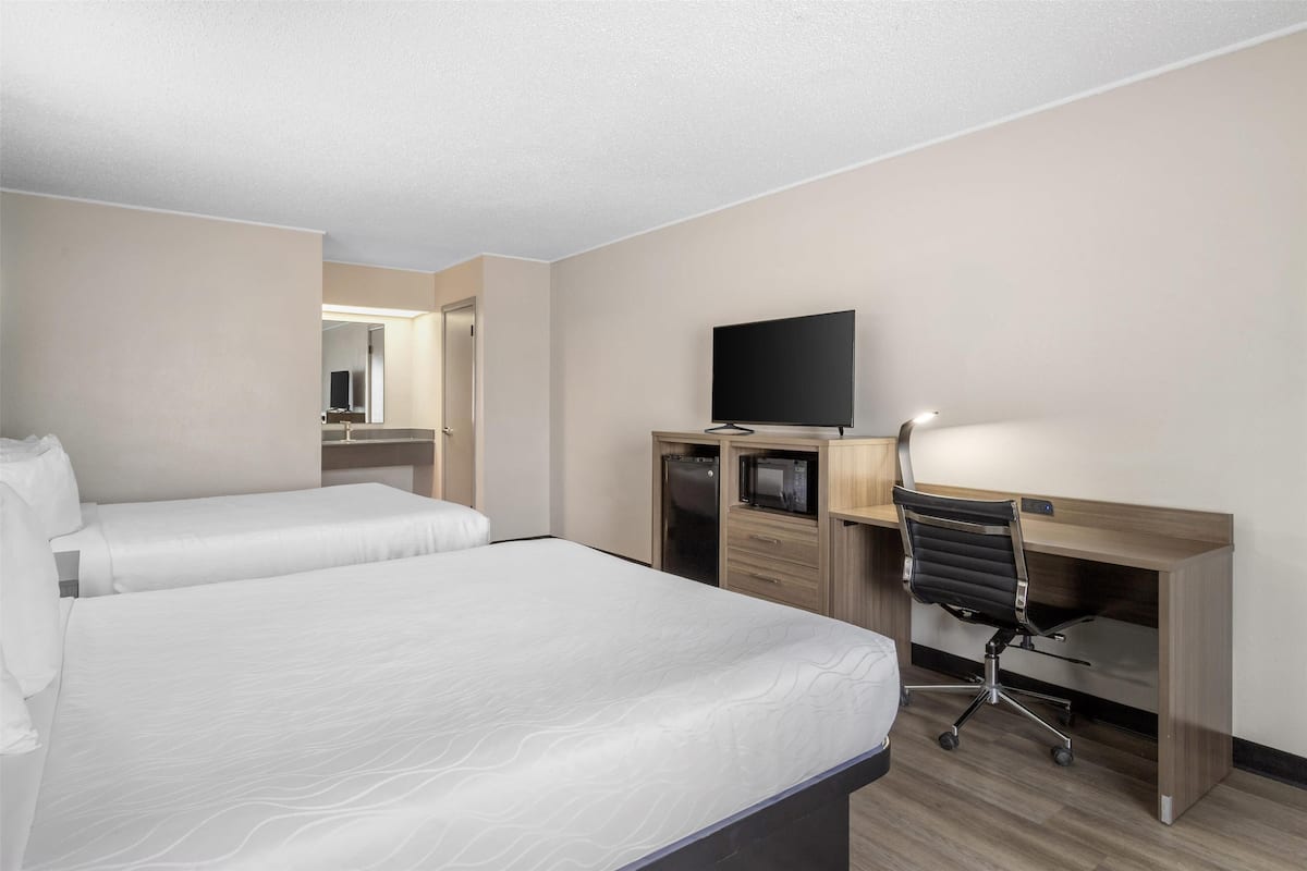 Standard Room, 2 Queen Beds, Non Smoking, Refrigerator & Microwave | Desk, laptop workspace, blackout drapes, iron/ironing board