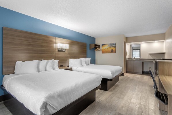 Standard Room, 2 Queen Beds, Refrigerator & Microwave, Pool View | Desk, laptop workspace, blackout drapes, iron/ironing board