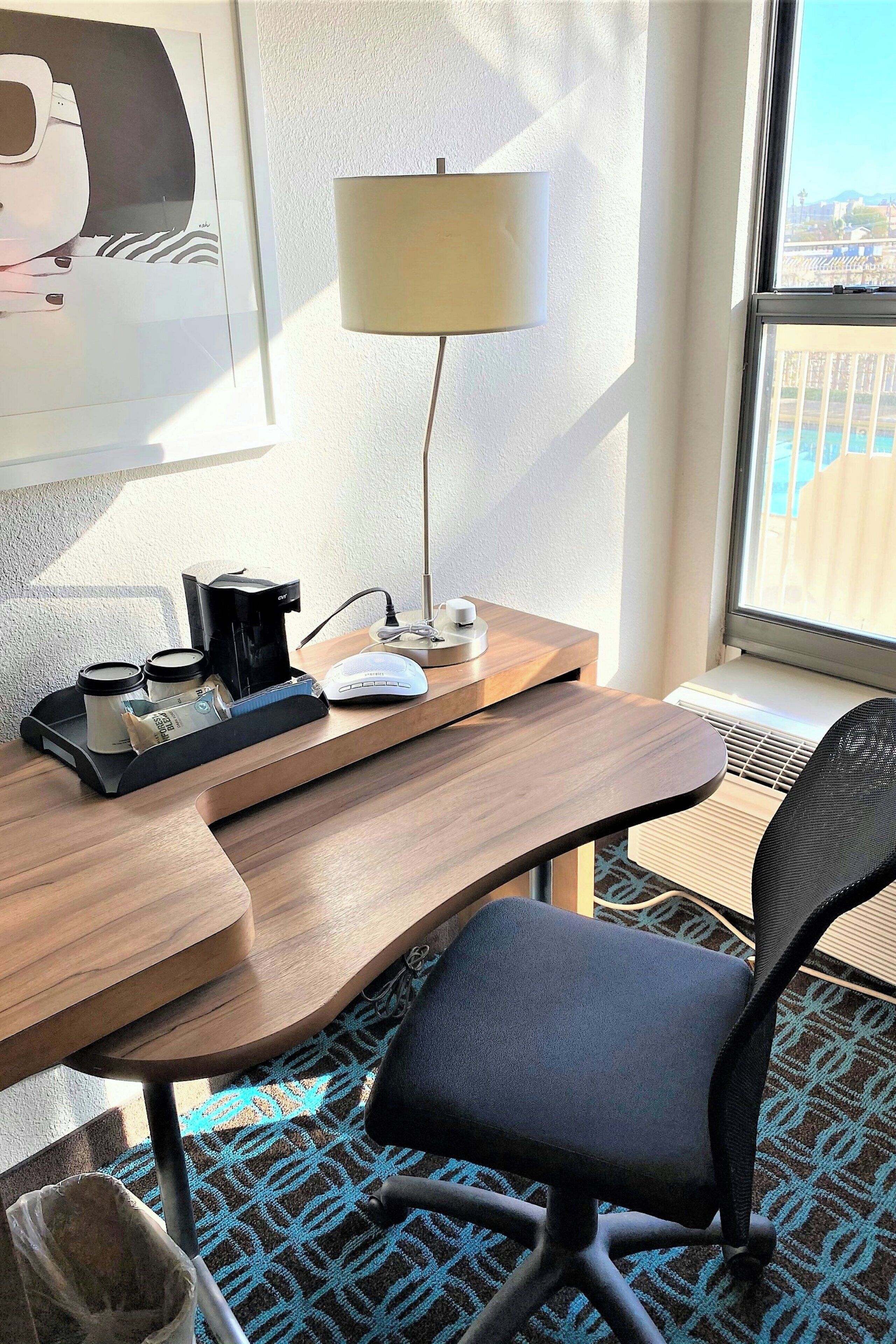 desk, laptop workspace, blackout curtains, iron/ironing board