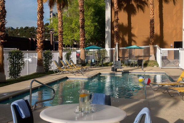 Outdoor pool, open 7:00 AM to 10:00 PM, pool loungers