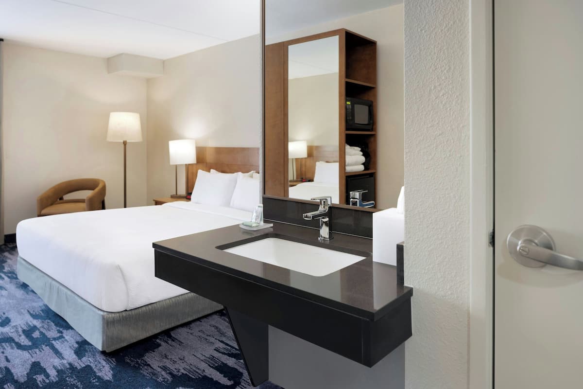 Room, 1 King Bed with Sofa bed (Mobility/Hearing Access, Roll-In Shwr) | Desk, laptop workspace, blackout drapes, iron/ironing board