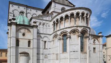 A historic building with a dome and arched windows.