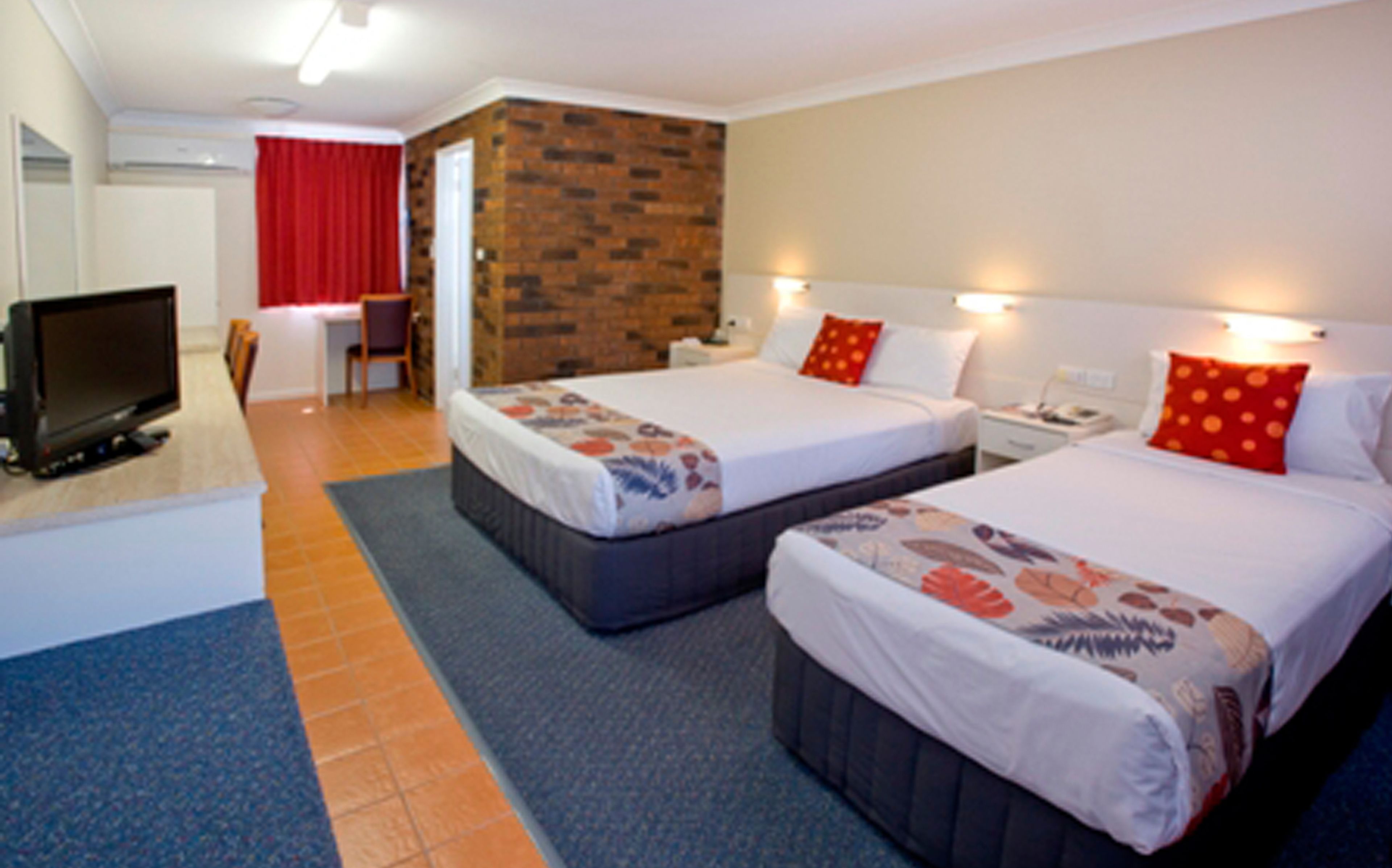 standard room, multiple beds, non smoking | pillow-top beds, desk, blackout curtains, iron/ironing board