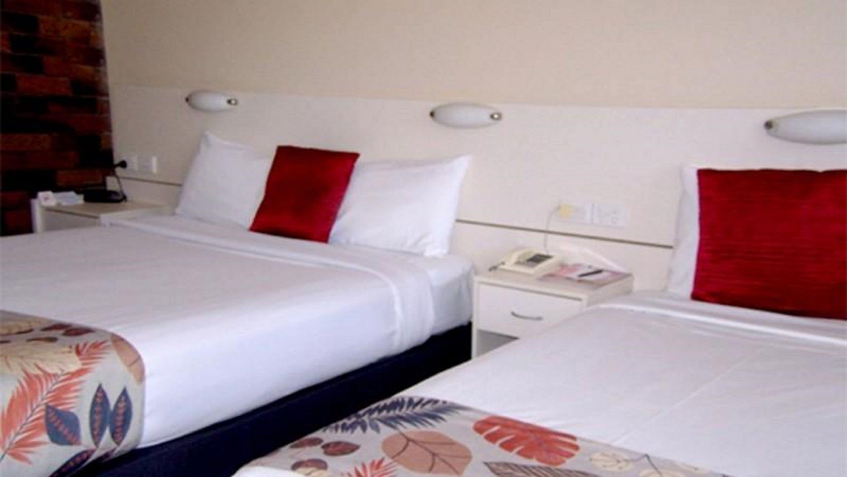 standard room, multiple beds, non smoking | pillow-top beds, desk, blackout curtains, iron/ironing board