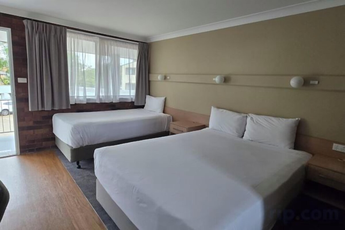 Pillowtop beds, desk, blackout drapes, iron/ironing board