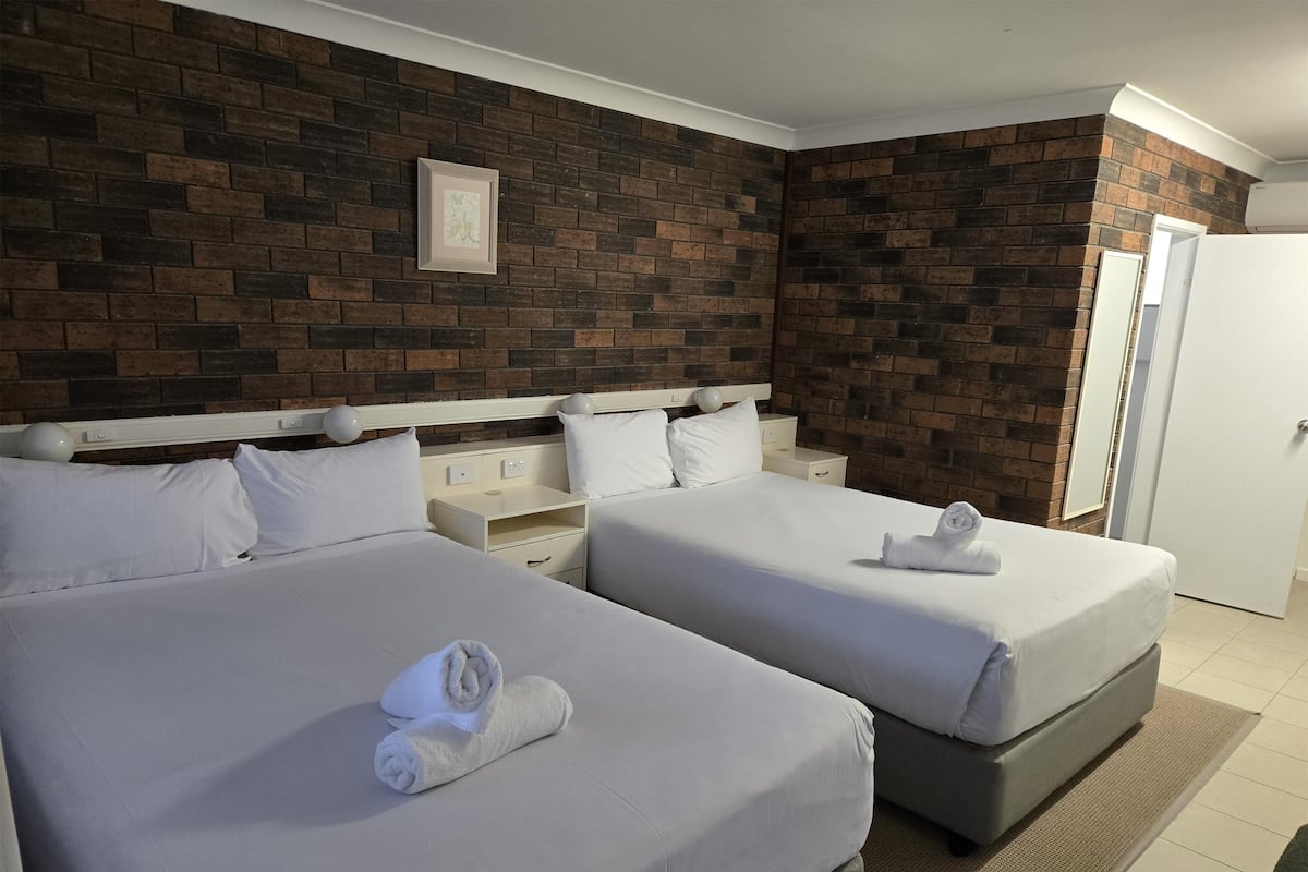 Pillow-top beds, desk, blackout curtains, iron/ironing board