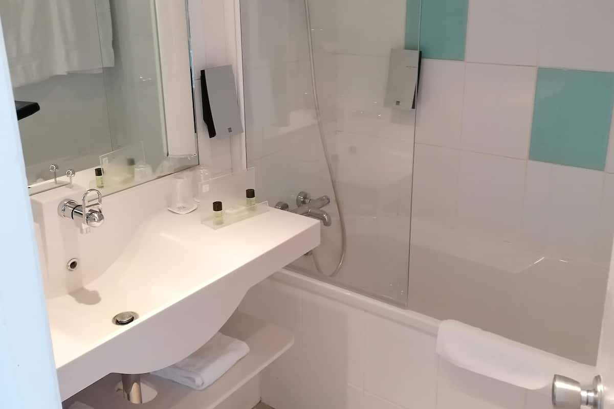 standard room, 1 queen bed with sofa bed | bathroom | free toiletries, hair dryer, towels