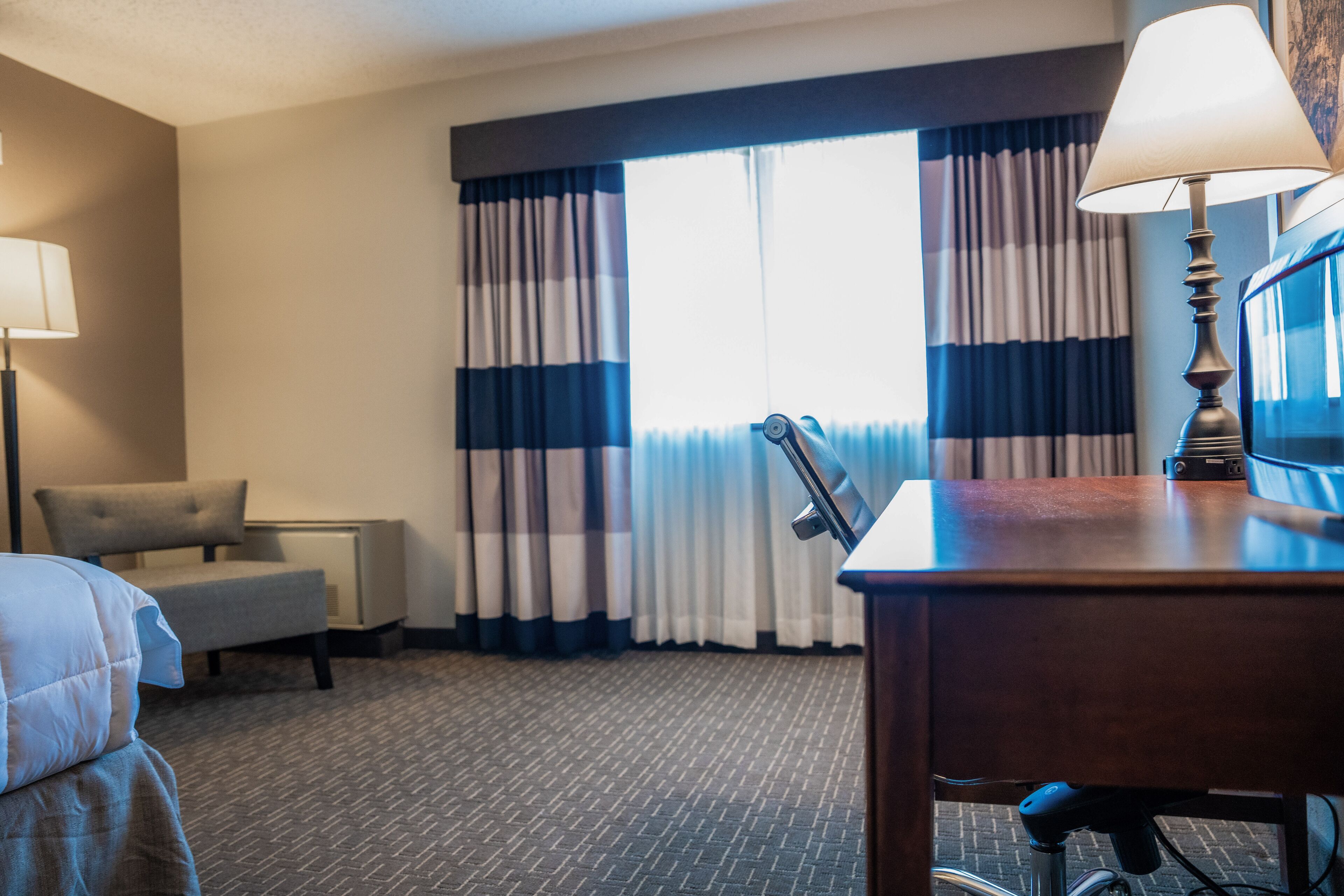 desk, blackout curtains, iron/ironing board, free cots/infant beds