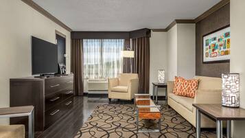 Suite, 1 Bedroom | Living area | 49-inch flat-screen TV with cable channels, TV, pay movies