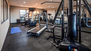 A gym with treadmills, elliptical machines, and weightlifting equipment. - Best Western Jacksonville near Little Rock Air Force Base (Jacksonville)