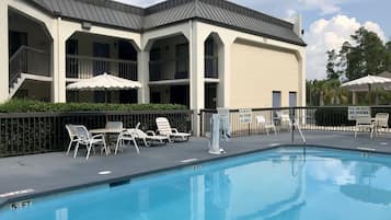 Seasonal outdoor pool, open 9:00 AM to 9 PM, pool umbrellas