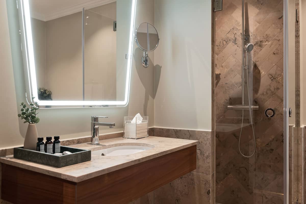 deluxe room | bathroom | designer toiletries, hair dryer, towels