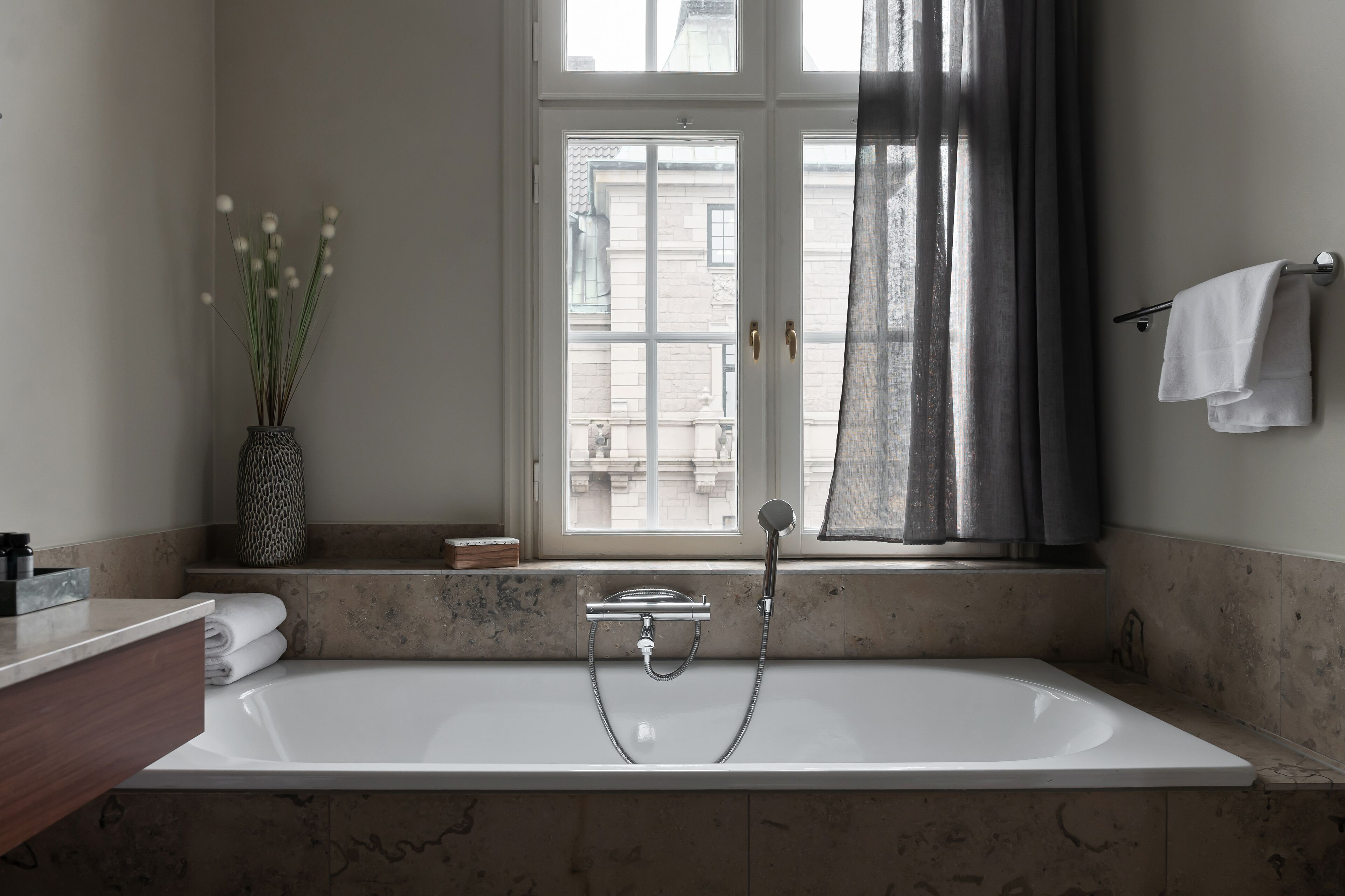 junior suite | bathroom | designer toiletries, hair dryer, towels