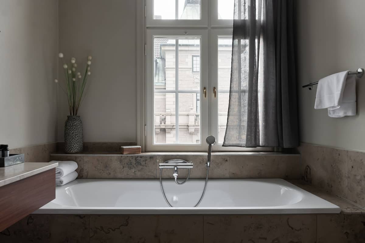 junior suite | bathroom | designer toiletries, hair dryer, towels