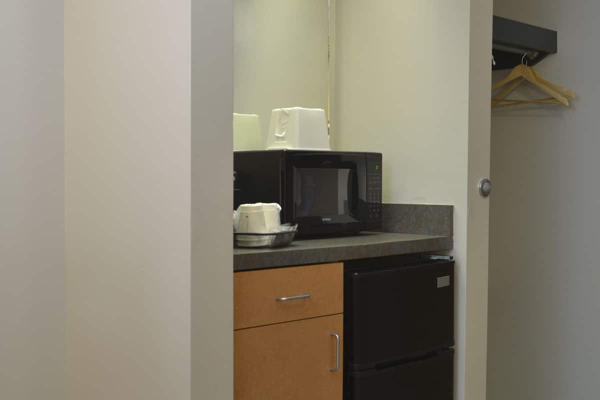 studio suite, 1 king bed, non smoking | desk, laptop workspace, blackout curtains, iron/ironing board