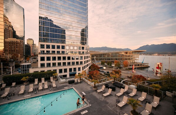Outdoor pool, a heated pool, pool umbrellas, sun loungers