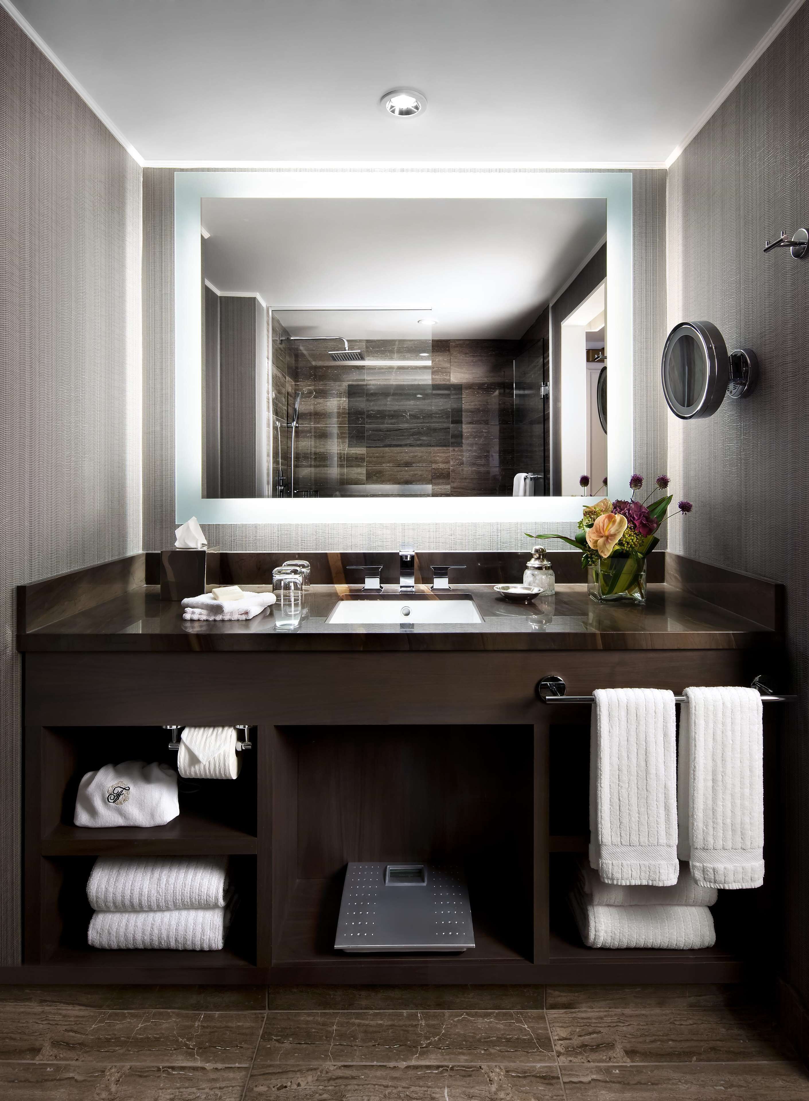 combined shower/bathtub, designer toiletries, hair dryer, bathrobes