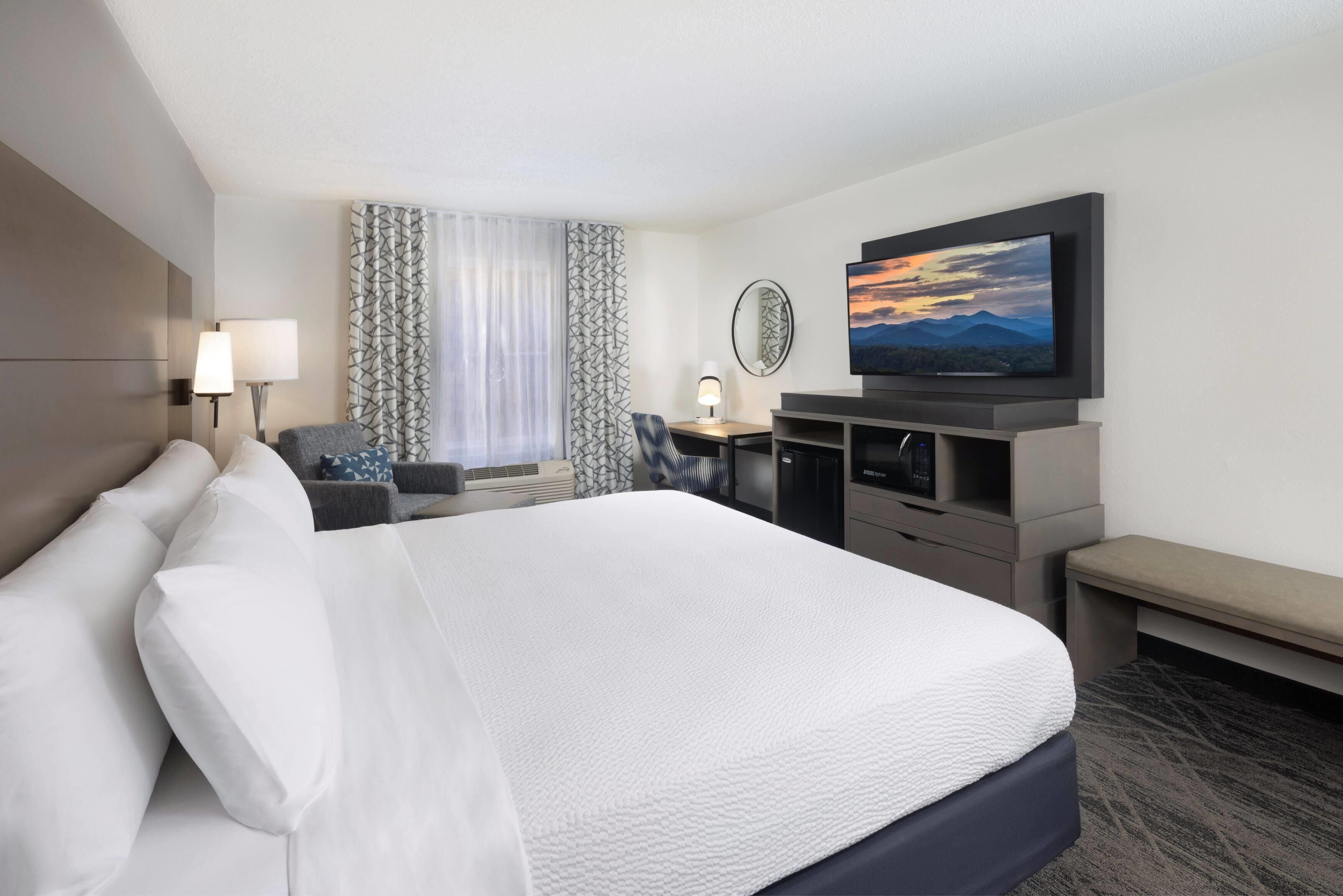 Premium bedding, desk, blackout curtains, iron/ironing board