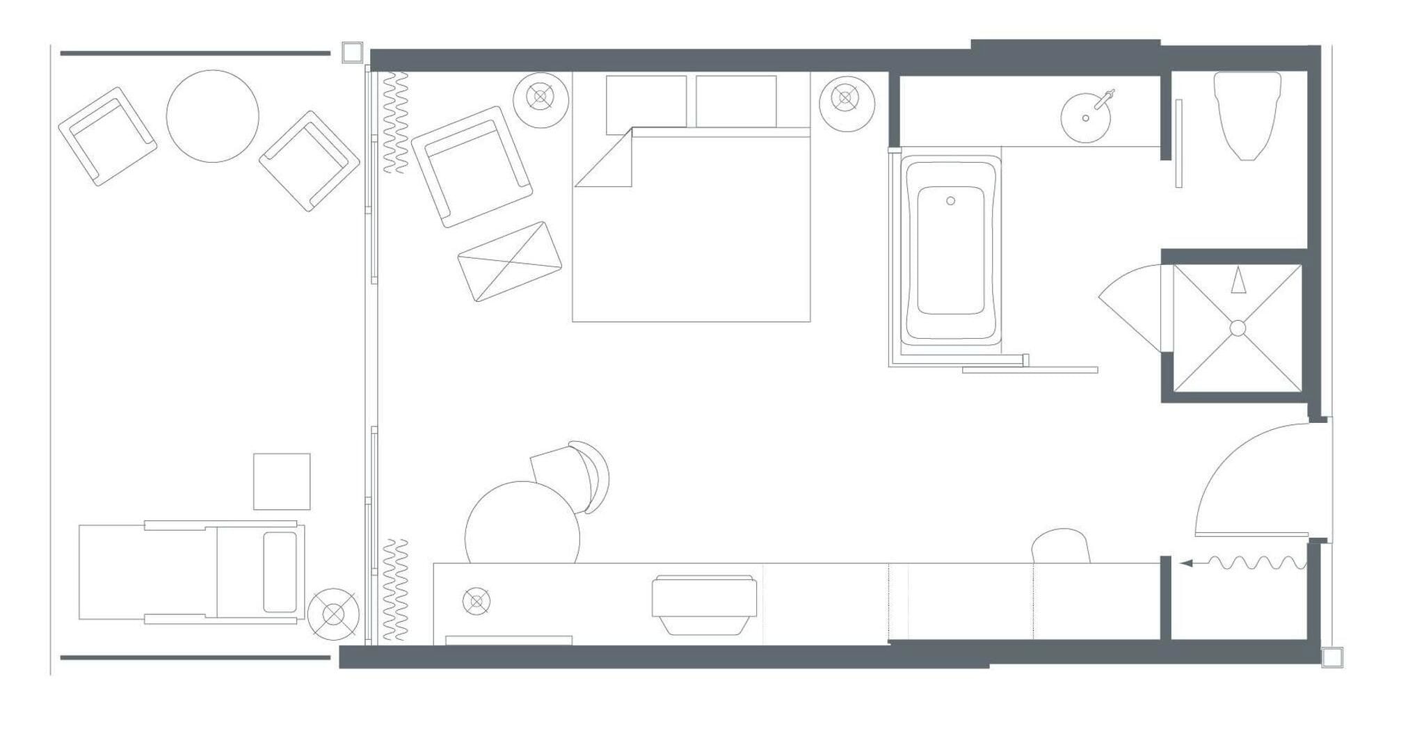 Un plan d’étage d’hôtel comprenant un couloir central, plusieurs chambres, une salle de bain et un coin repas.