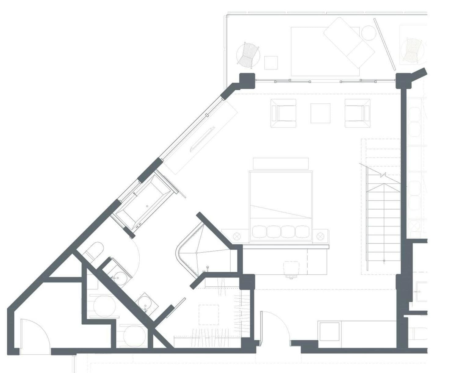 A floor plan of a building with multiple rooms, including a kitchen, dining area, and living spaces.
