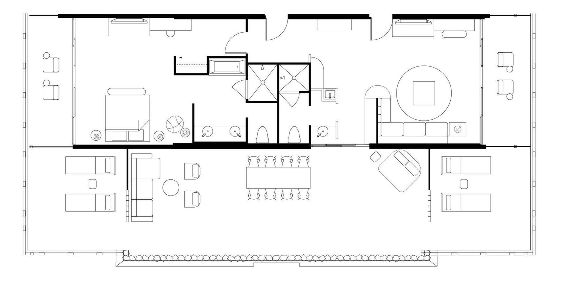 A floor plan of a hotel with multiple rooms, a dining area, and a kitchen.
