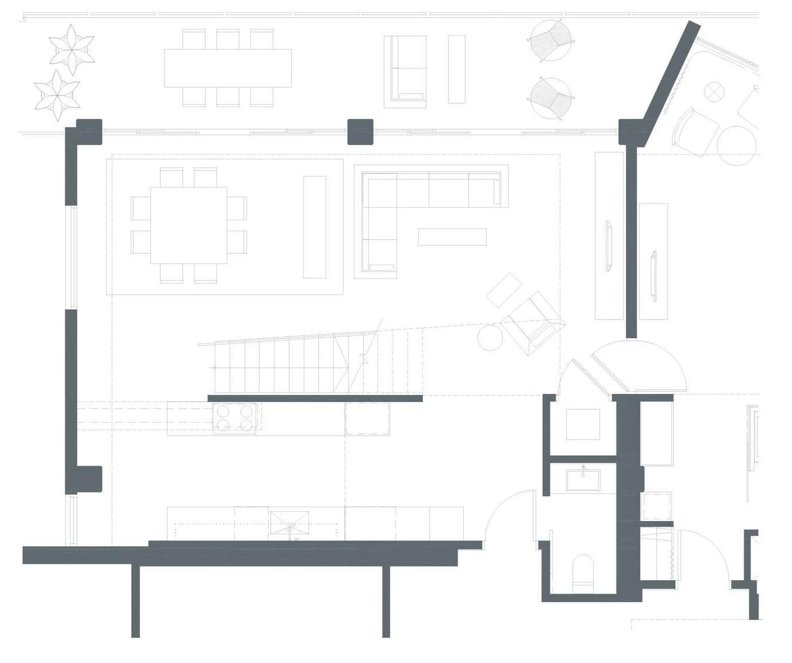 Plano de planta de un hotel que muestra varias habitaciones, un hall central y una escalera.