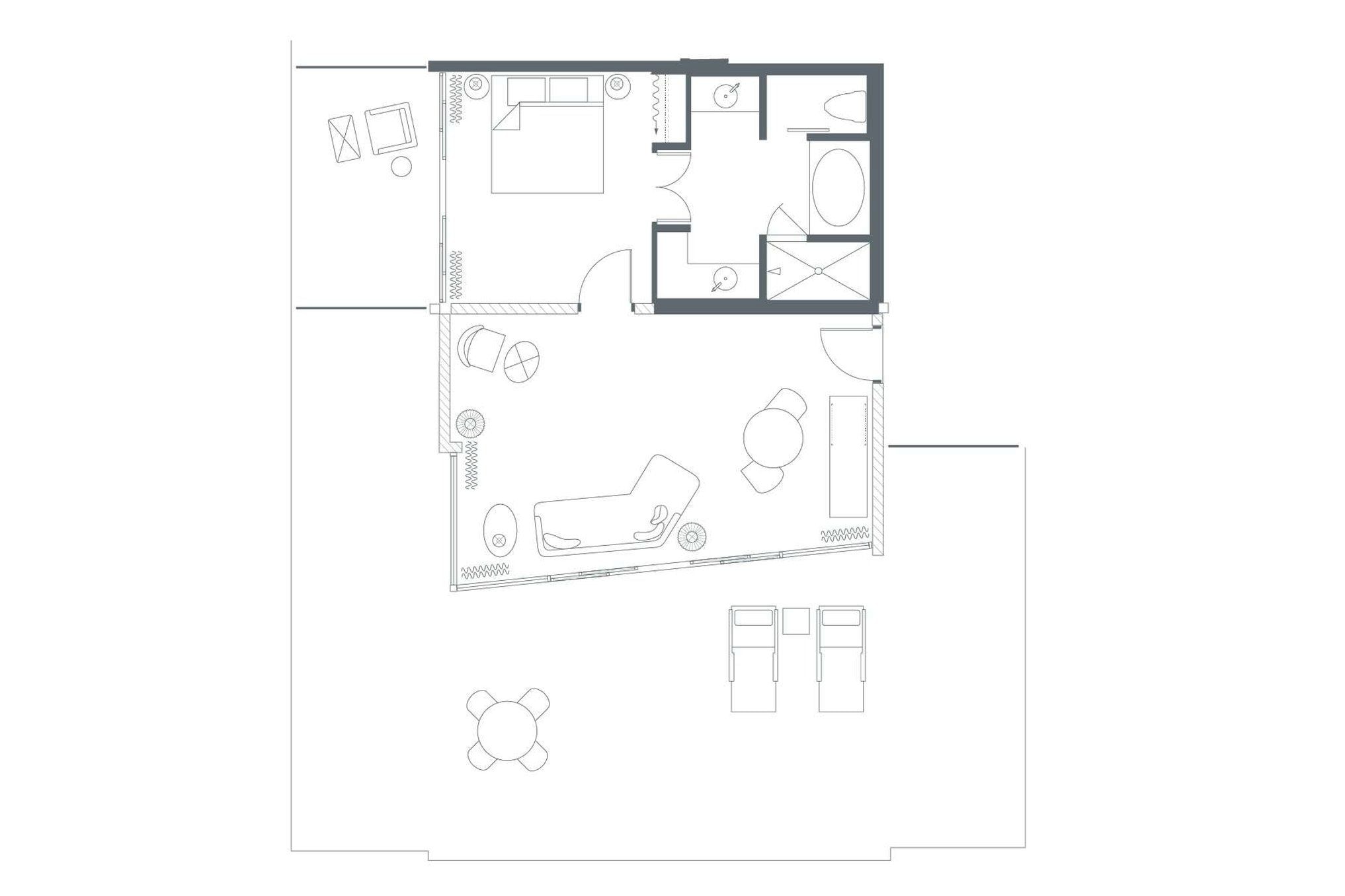 A floor plan with a kitchen, dining area, and a living room with a sofa and coffee table.
