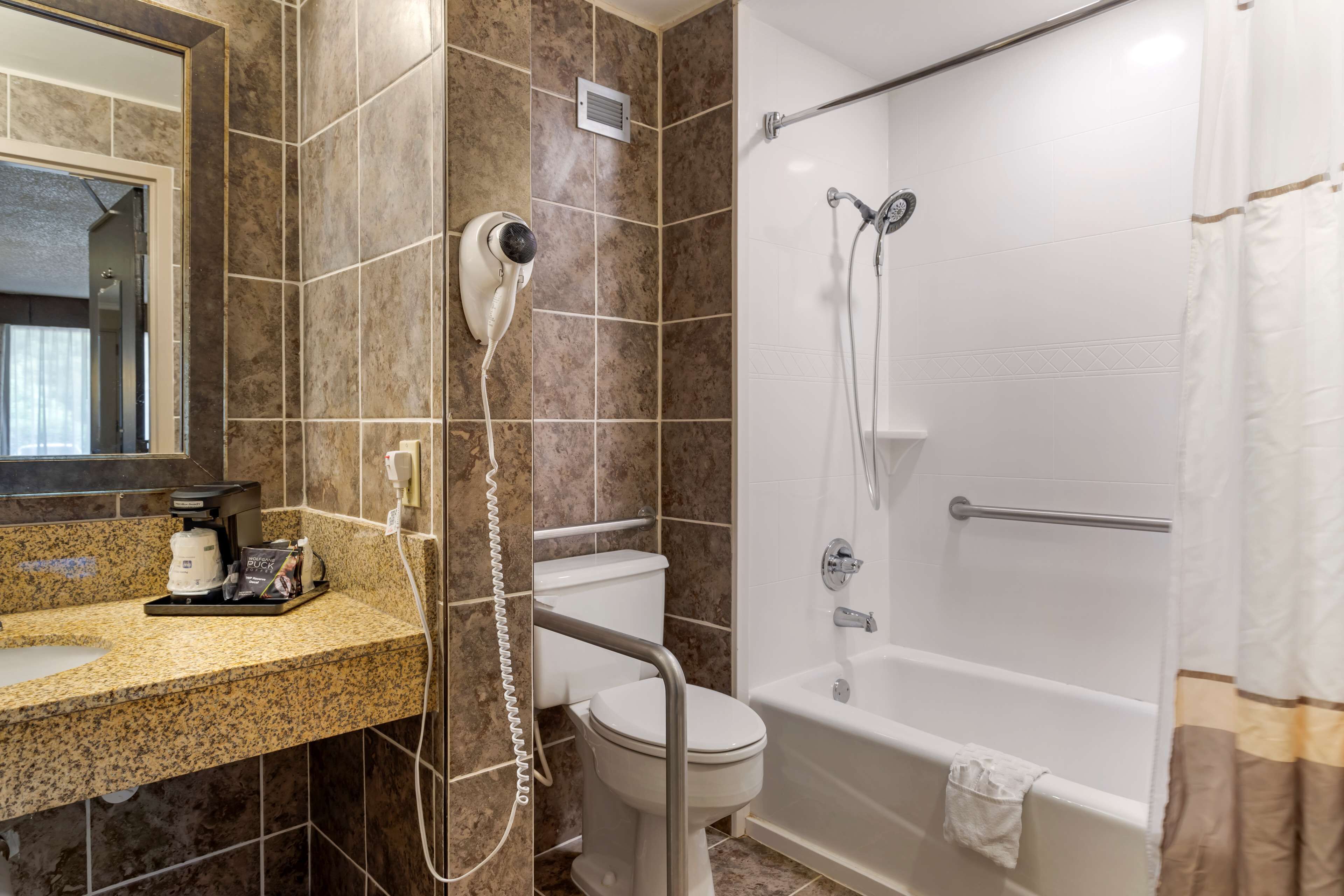 bathtub, free toiletries, hair dryer, towels