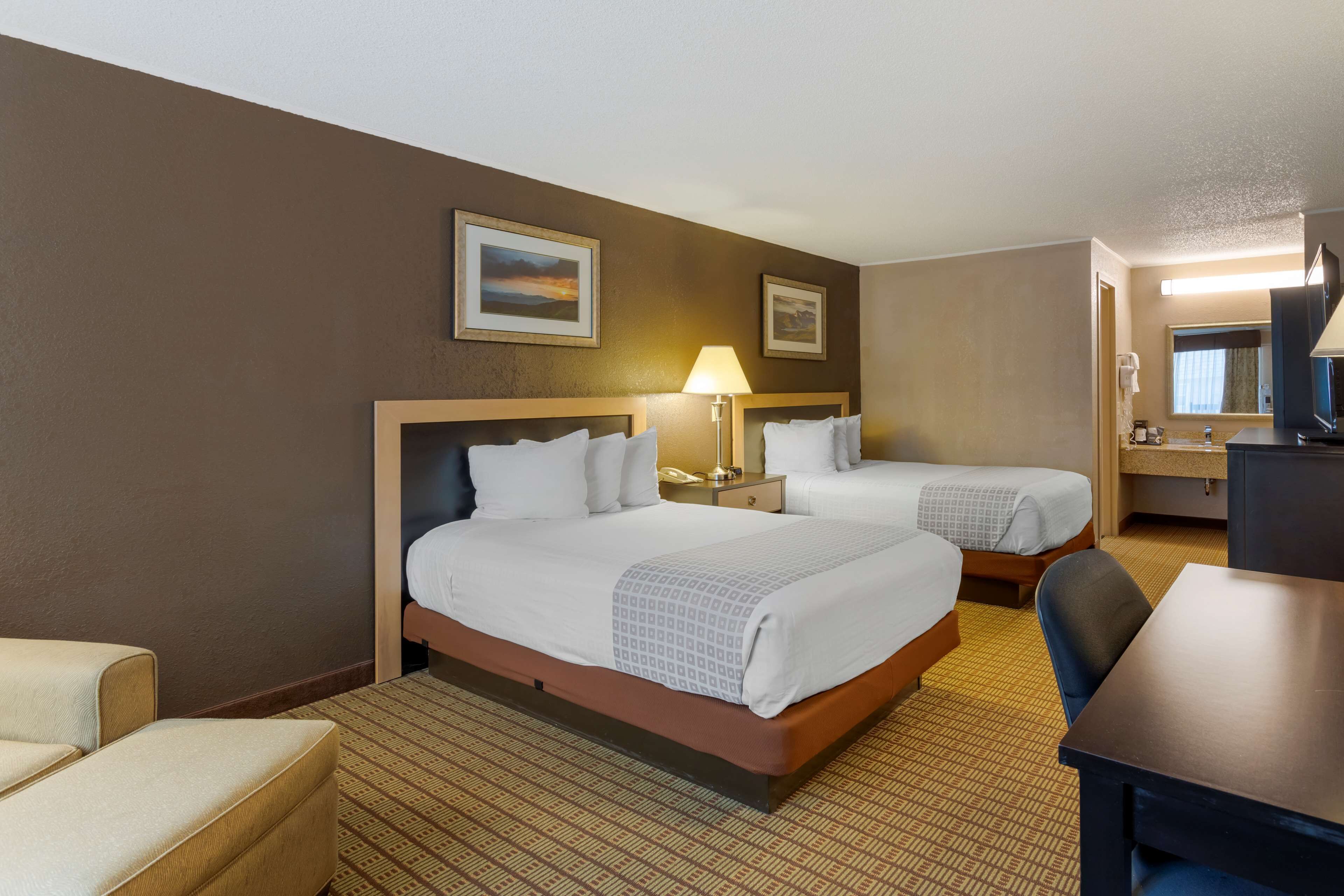 standard room, 2 double beds, non smoking, refrigerator & microwave | in-room safe, desk, laptop workspace, iron/ironing board