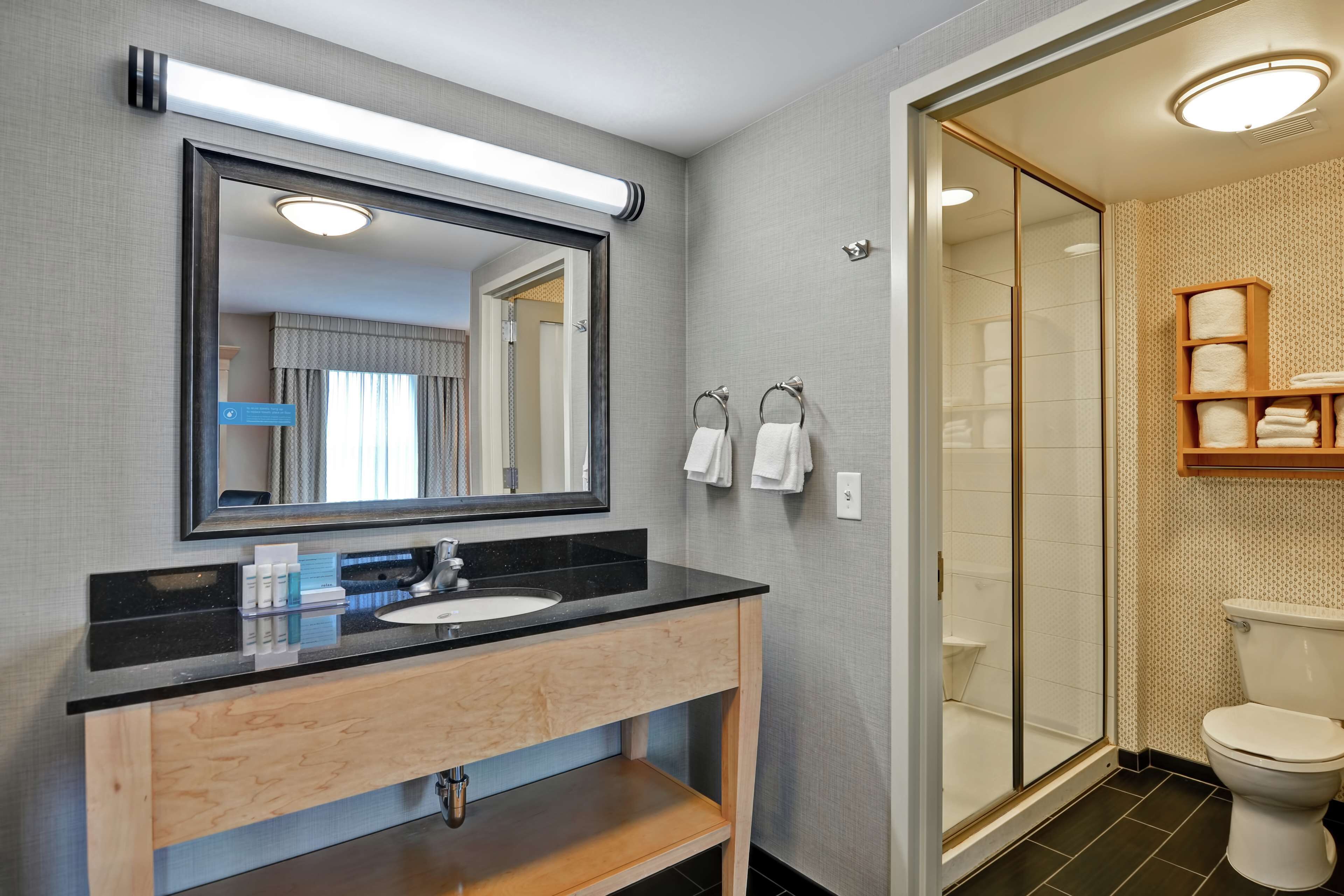 king studio suite | bathroom | shower, hair dryer, towels