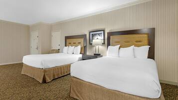 Premium bedding, desk, laptop workspace, blackout drapes