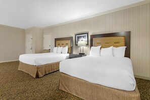 Premium bedding, desk, laptop workspace, blackout curtains