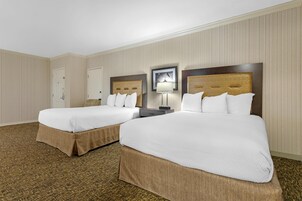 Premium bedding, desk, laptop workspace, blackout drapes