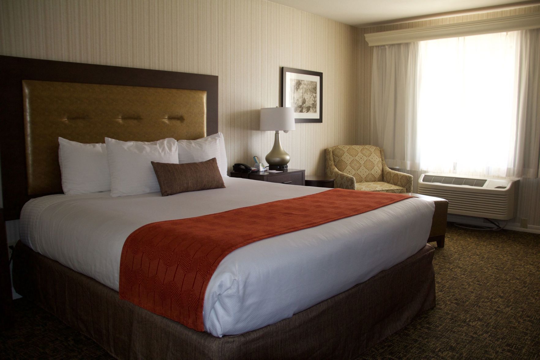 Premium bedding, desk, laptop workspace, blackout curtains