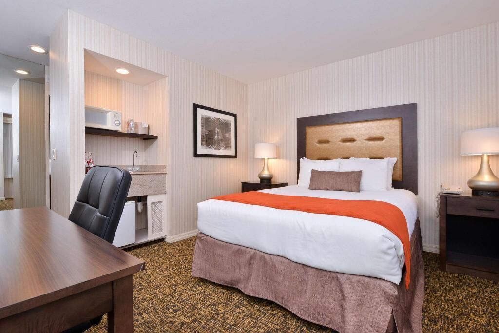 Premium bedding, desk, laptop workspace, blackout curtains