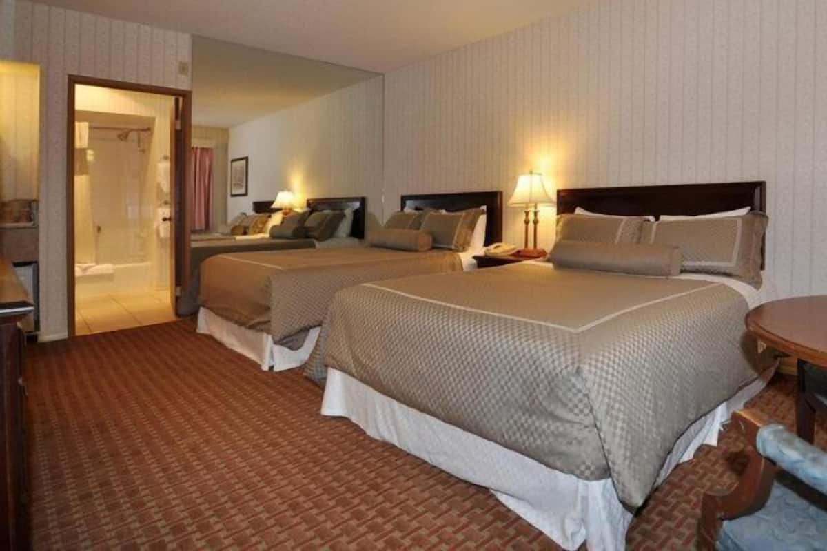 Premium bedding, desk, laptop workspace, blackout drapes