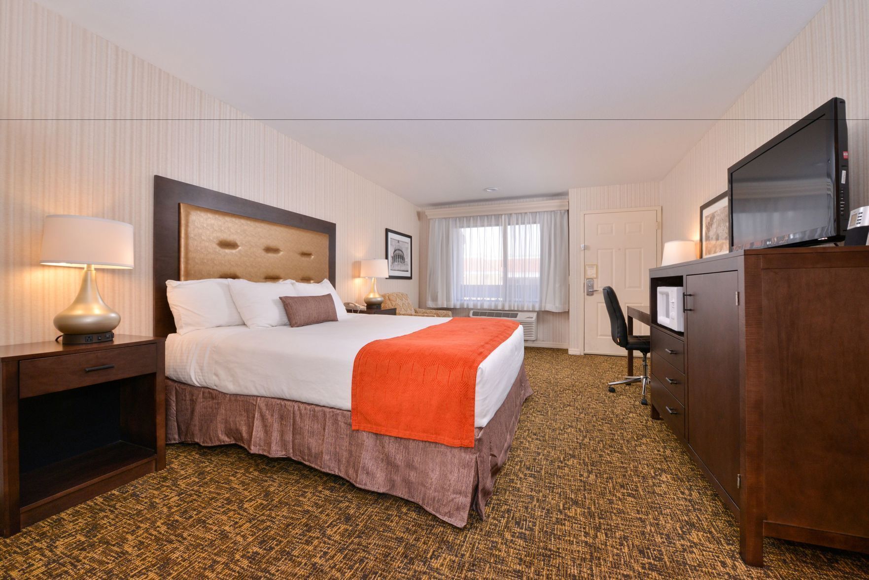 Premium bedding, desk, laptop workspace, blackout curtains